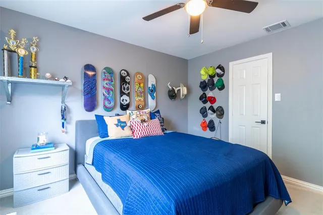 a bedroom with a bed and a dresser