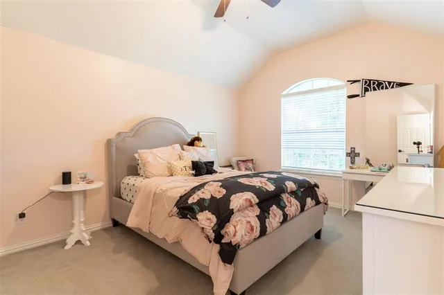 a bed room with a bed and a table