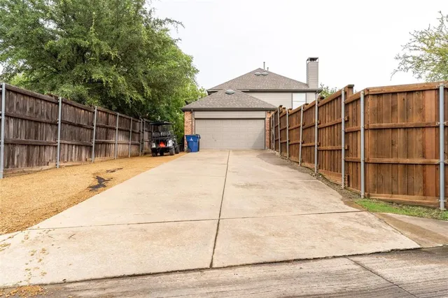a view of a terrace with wooden fence