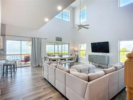 a large kitchen with a table and chairs