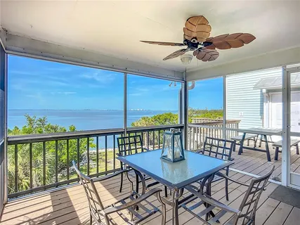 a view of a balcony with furniture