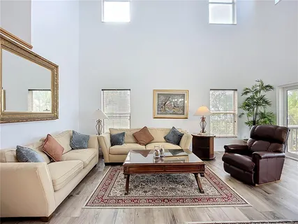 a kitchen with granite countertop a sink cabinets and window