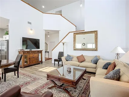 a kitchen with granite countertop a stove top oven sink and cabinets