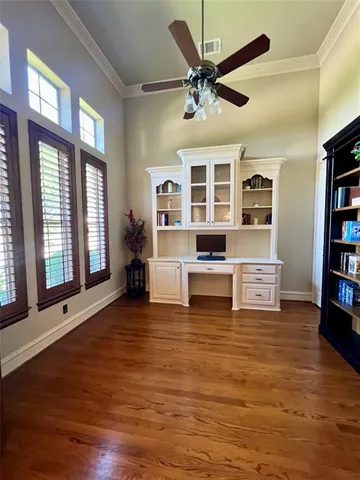 a view of a living room with furniture and windows