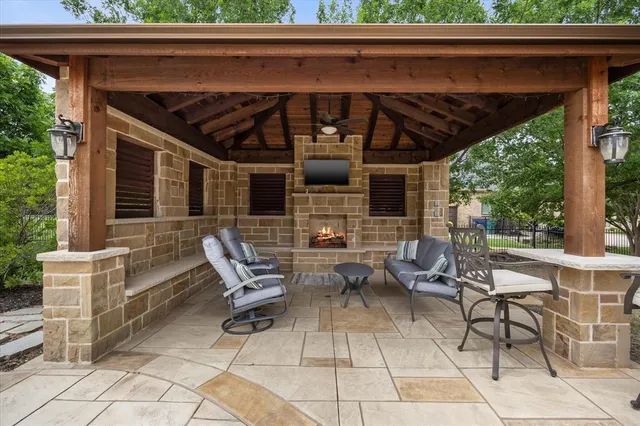 a view of patio with table and chairs