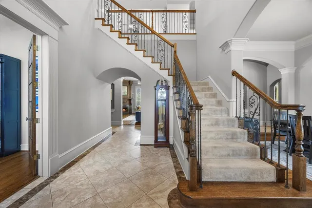a view of entryway and hall with wooden floor
