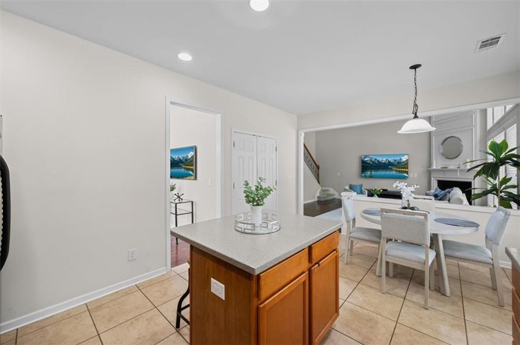 825 Poplar Terrace Canton, GA 30115 - Photo 11 of 46 a kitchen with a table and chairs