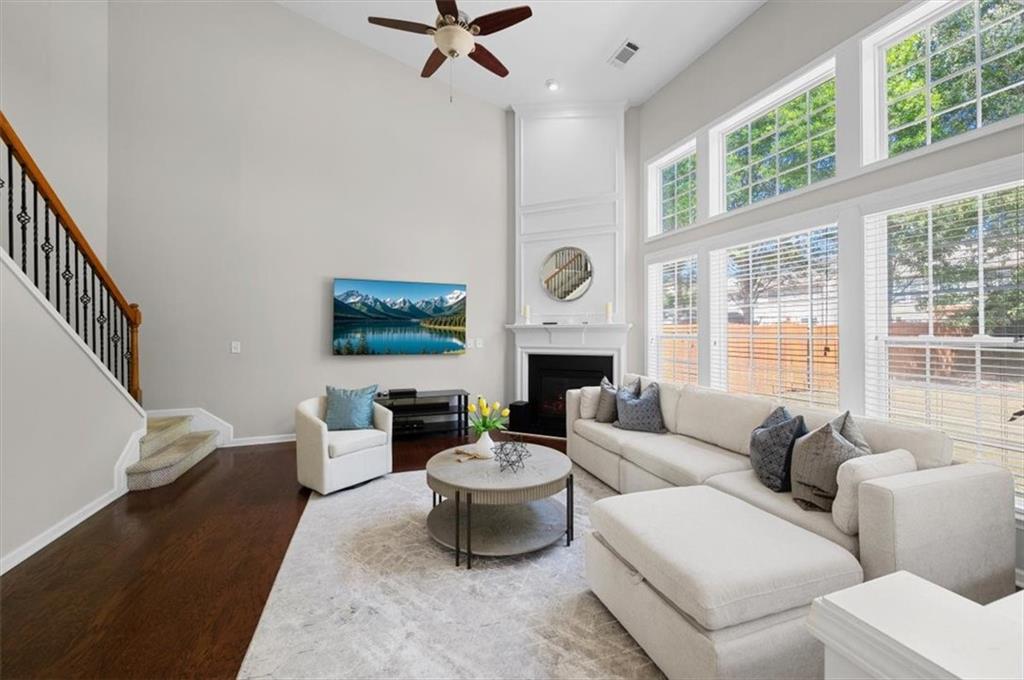 825 Poplar Terrace Canton, GA 30115 - Photo 16 of 46 a living room with furniture a fireplace and a large window