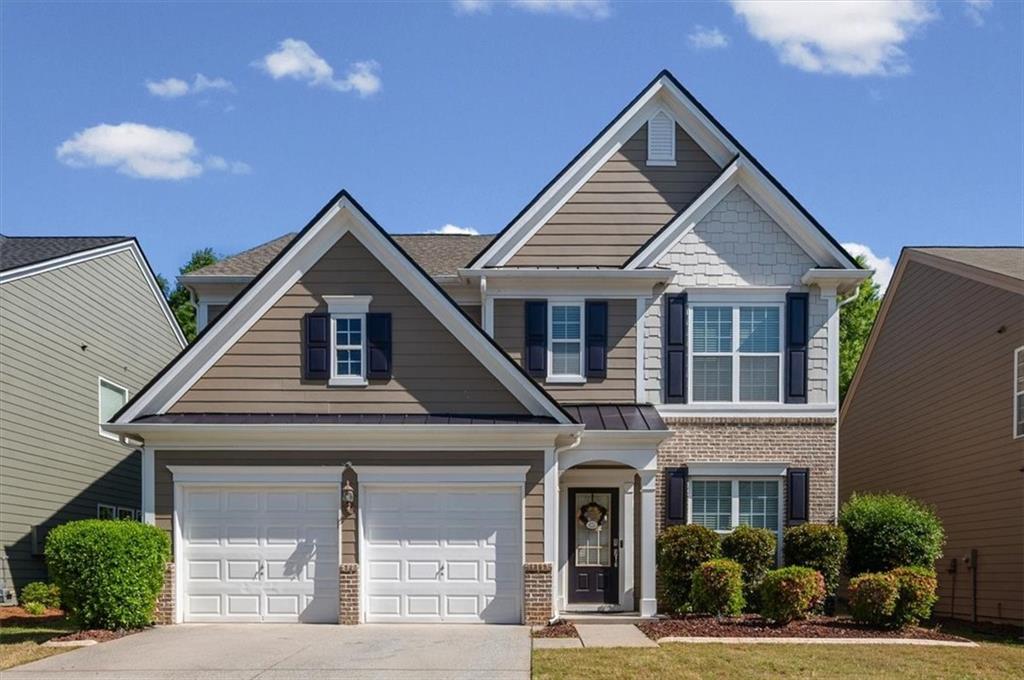 825 Poplar Terrace Canton, GA 30115 - Photo 2 of 46 a front view of a house with a yard