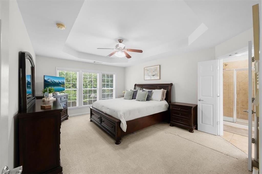 825 Poplar Terrace Canton, GA 30115 - Photo 22 of 46 a spacious bedroom with a bed and a large window