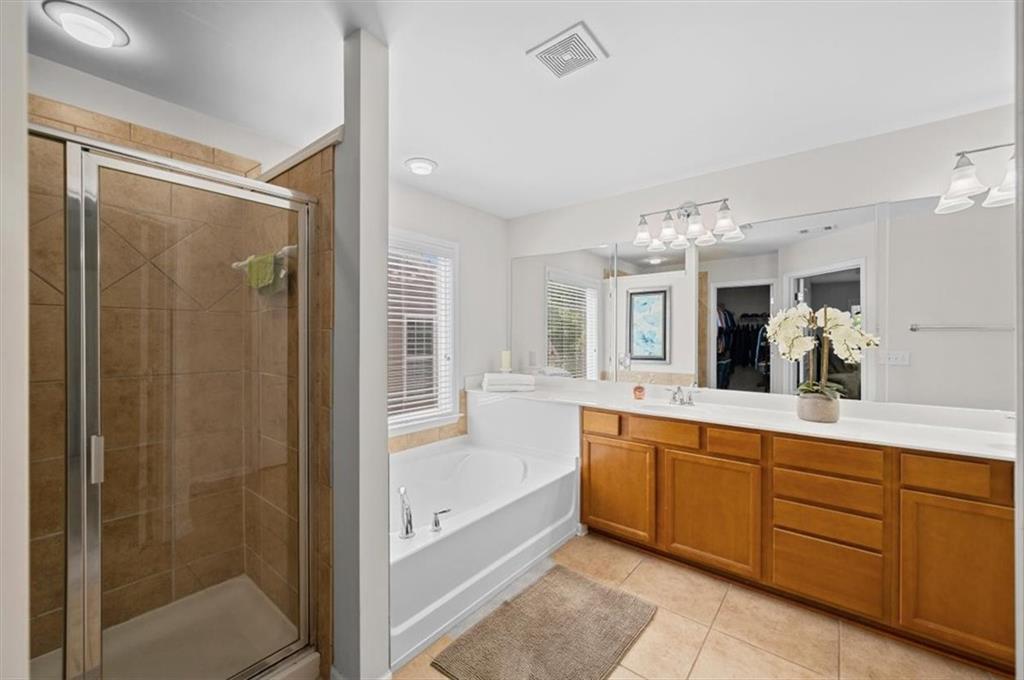 825 Poplar Terrace Canton, GA 30115 - Photo 25 of 46 a spacious bathroom with a tub shower and sink