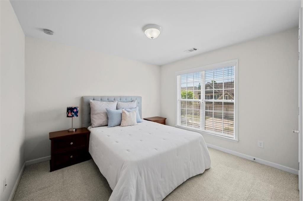 825 Poplar Terrace Canton, GA 30115 - Photo 29 of 46 a bedroom with a bed and a window