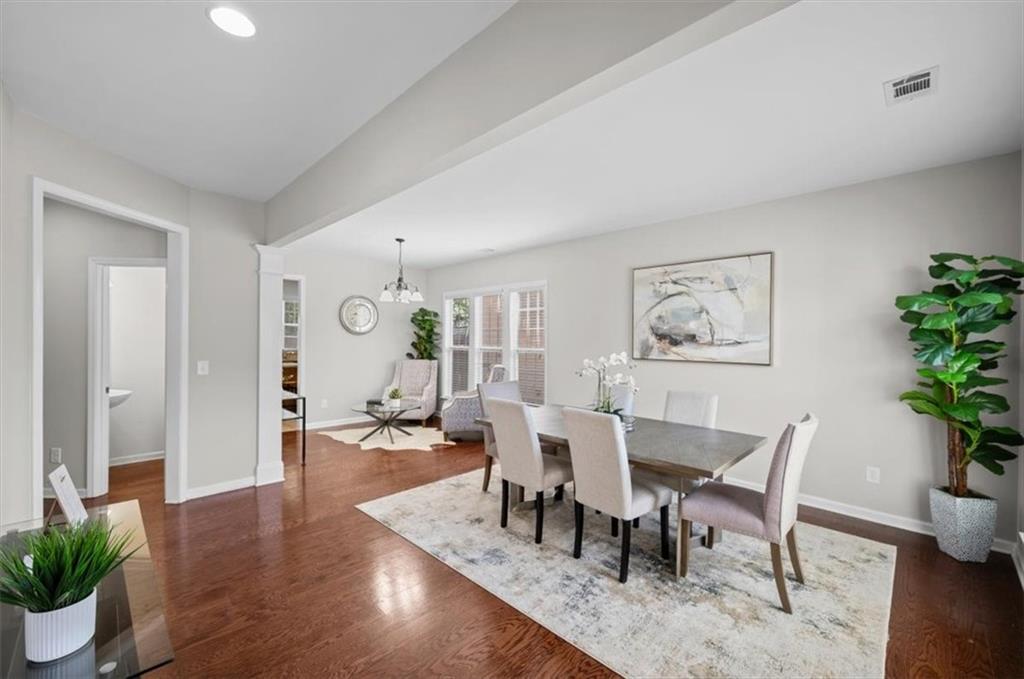 825 Poplar Terrace Canton, GA 30115 - Photo 6 of 46 a dining room with wooden floor and glass top table