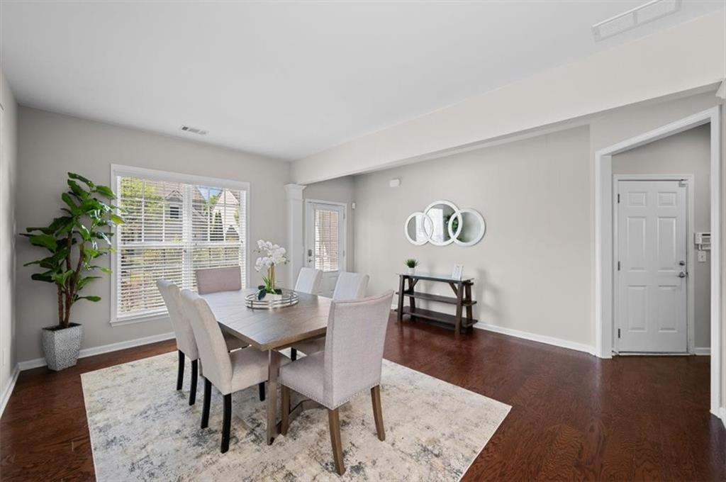 825 Poplar Terrace Canton, GA 30115 - Photo 7 of 46 a view of a dining room with furniture window and wooden floor