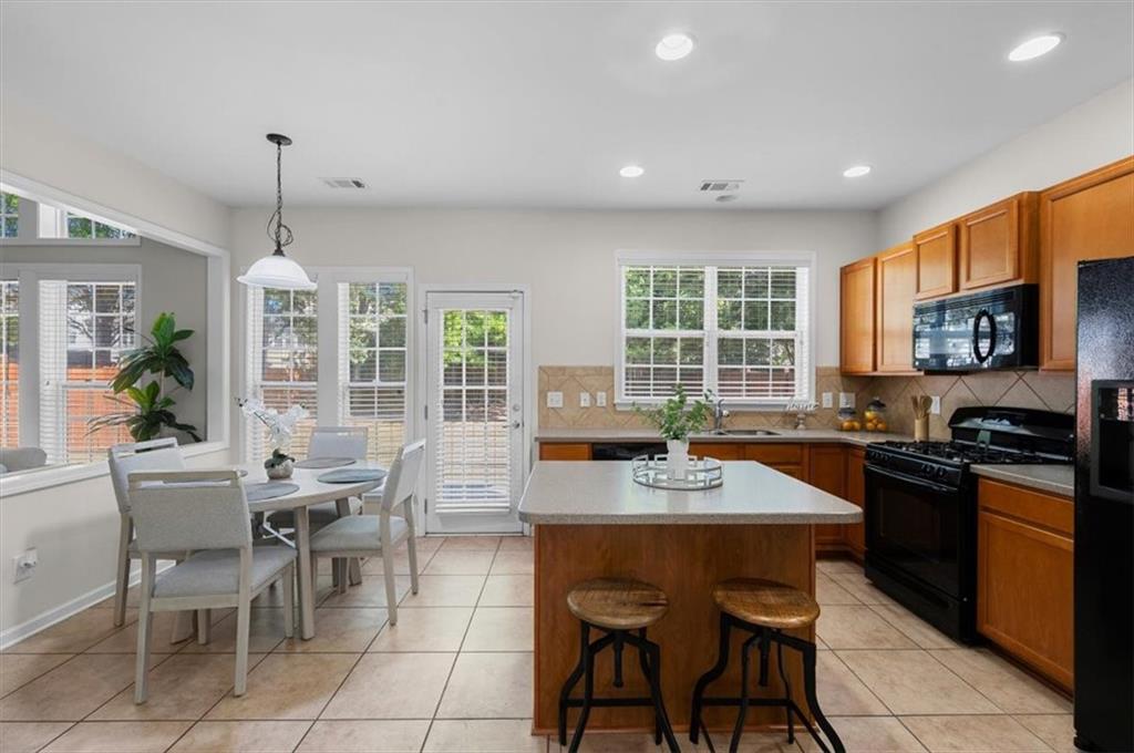 825 Poplar Terrace Canton, GA 30115 - Photo 10 of 46 a dining table with chairs and window