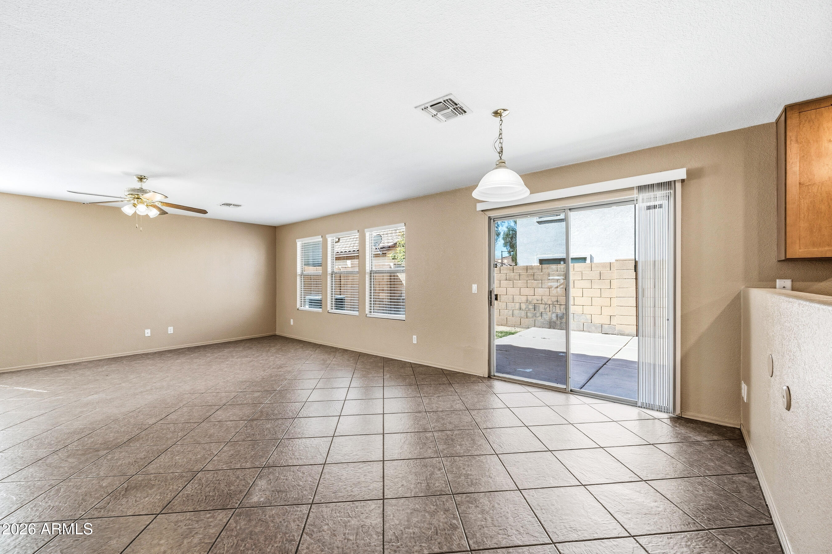 9515 West Monte Vista Road Phoenix, AZ 85037 - Photo 12 of 29 a view of an empty room with a window