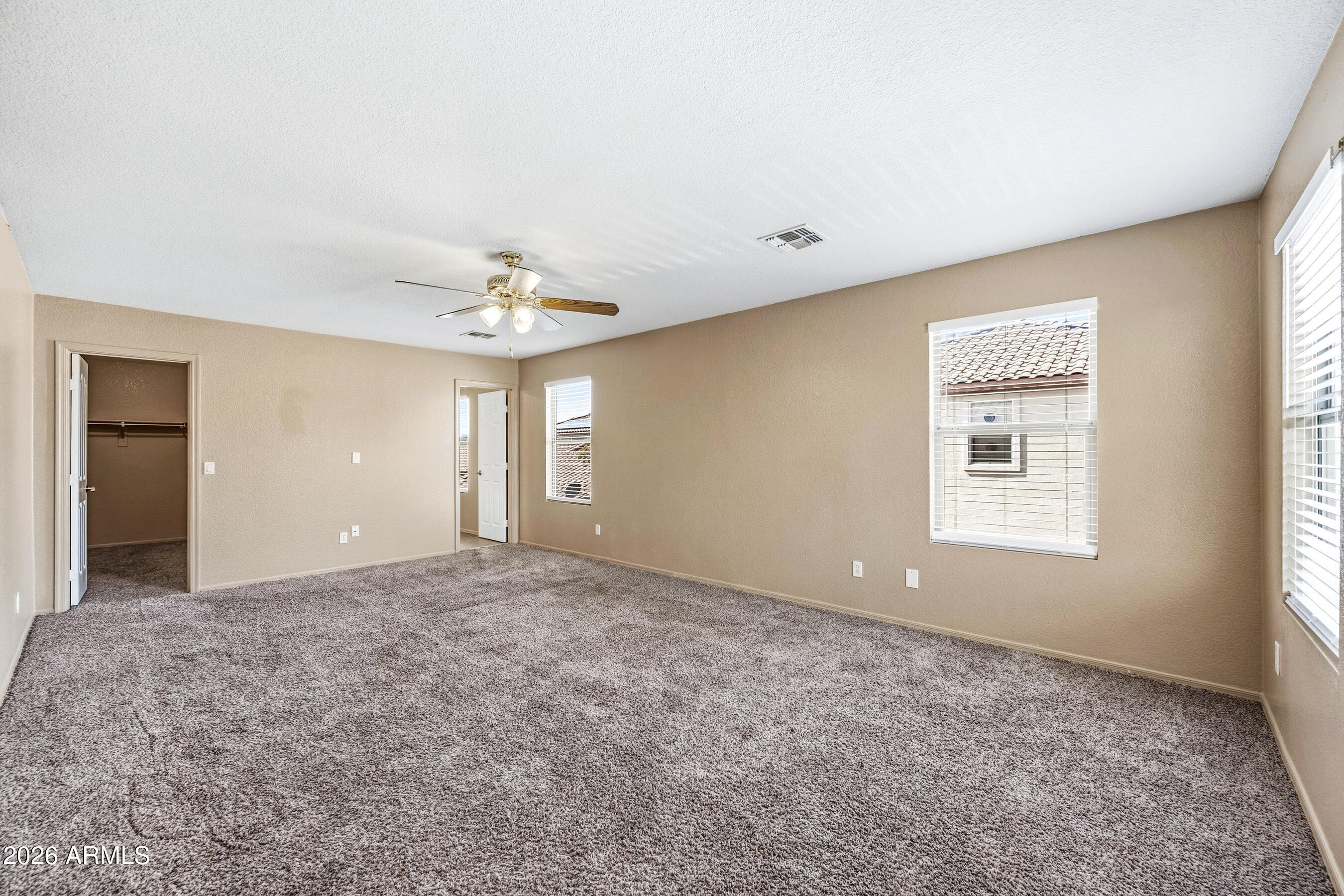 9515 West Monte Vista Road Phoenix, AZ 85037 - Photo 16 of 29 a view of an empty room with a window