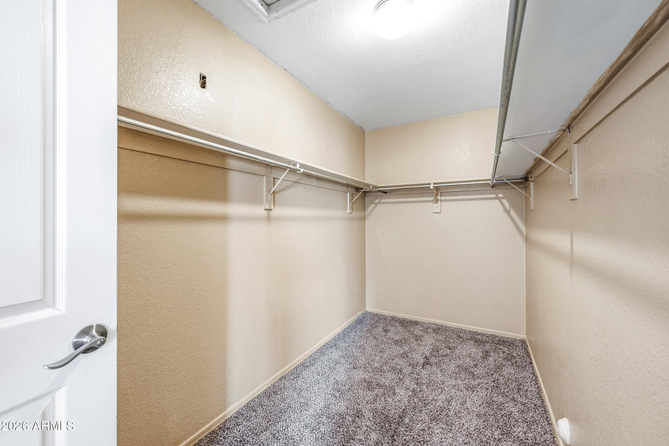 9515 West Monte Vista Road Phoenix, AZ 85037 - Photo 21 of 29 a view of walk in closet