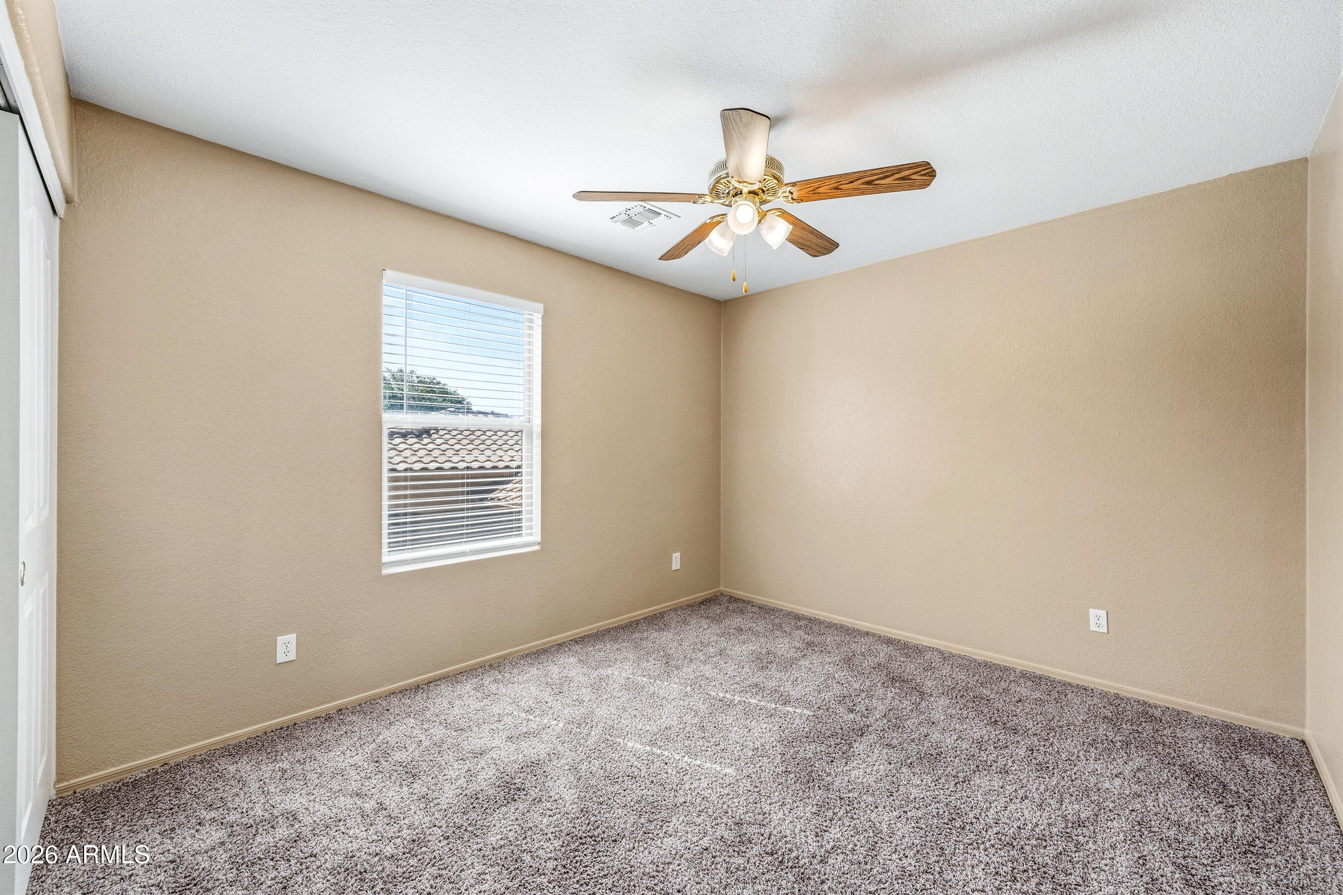 9515 West Monte Vista Road Phoenix, AZ 85037 - Photo 23 of 29 a view of an empty room with a window