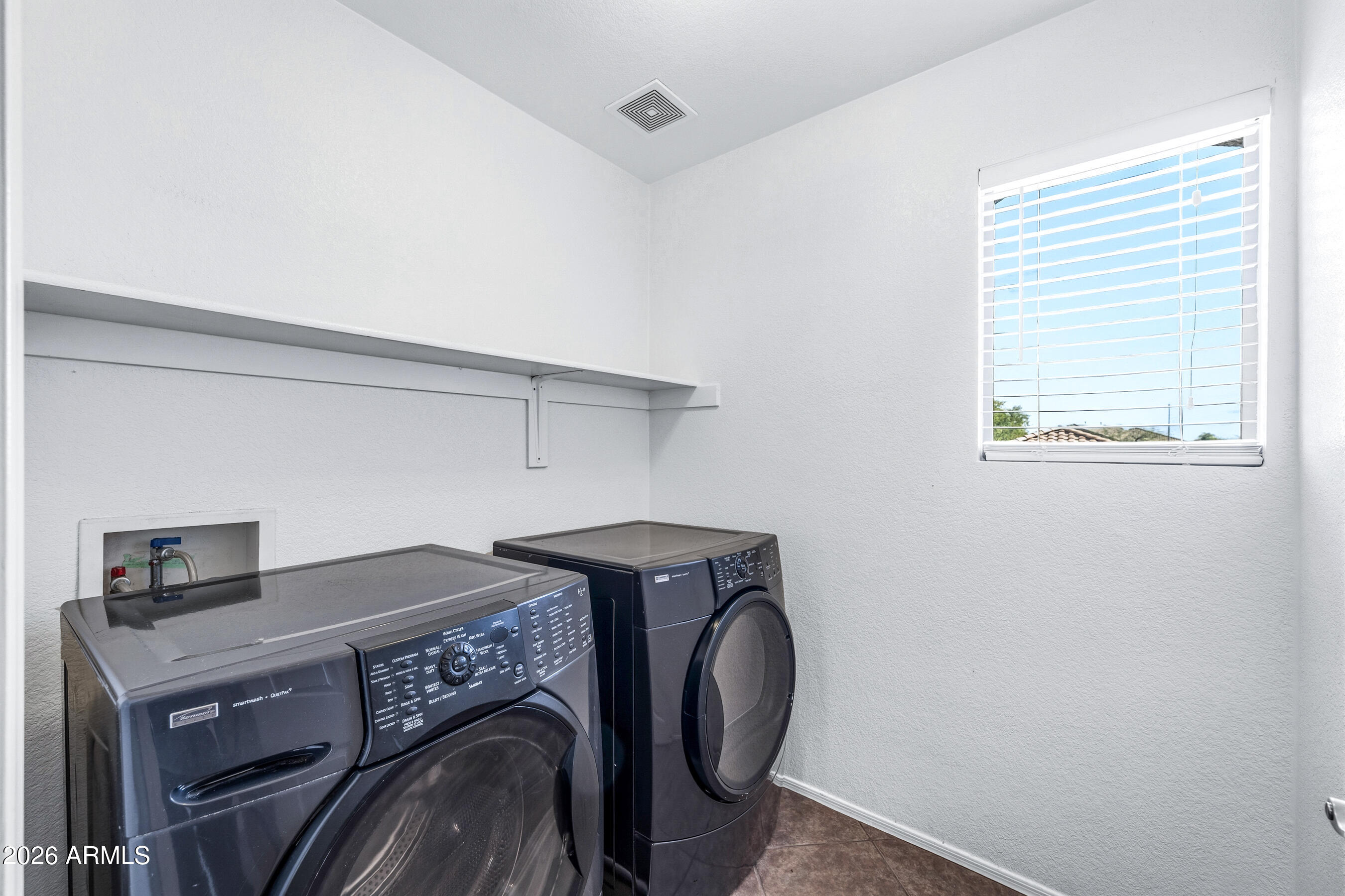 9515 West Monte Vista Road Phoenix, AZ 85037 - Photo 26 of 29 a utility room with dryer and washer