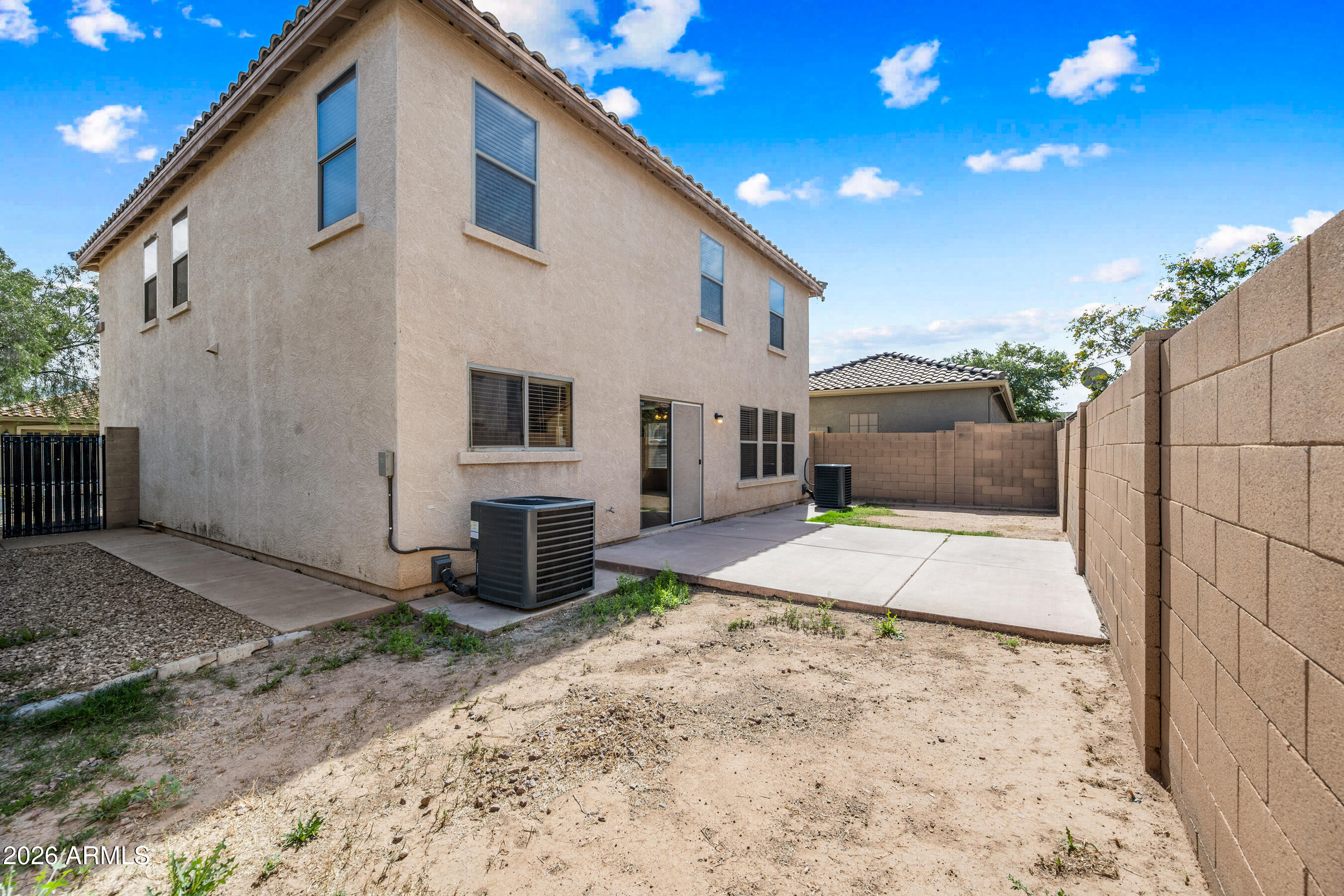 9515 West Monte Vista Road Phoenix, AZ 85037 - Photo 28 of 29 a front view of a house with a yard