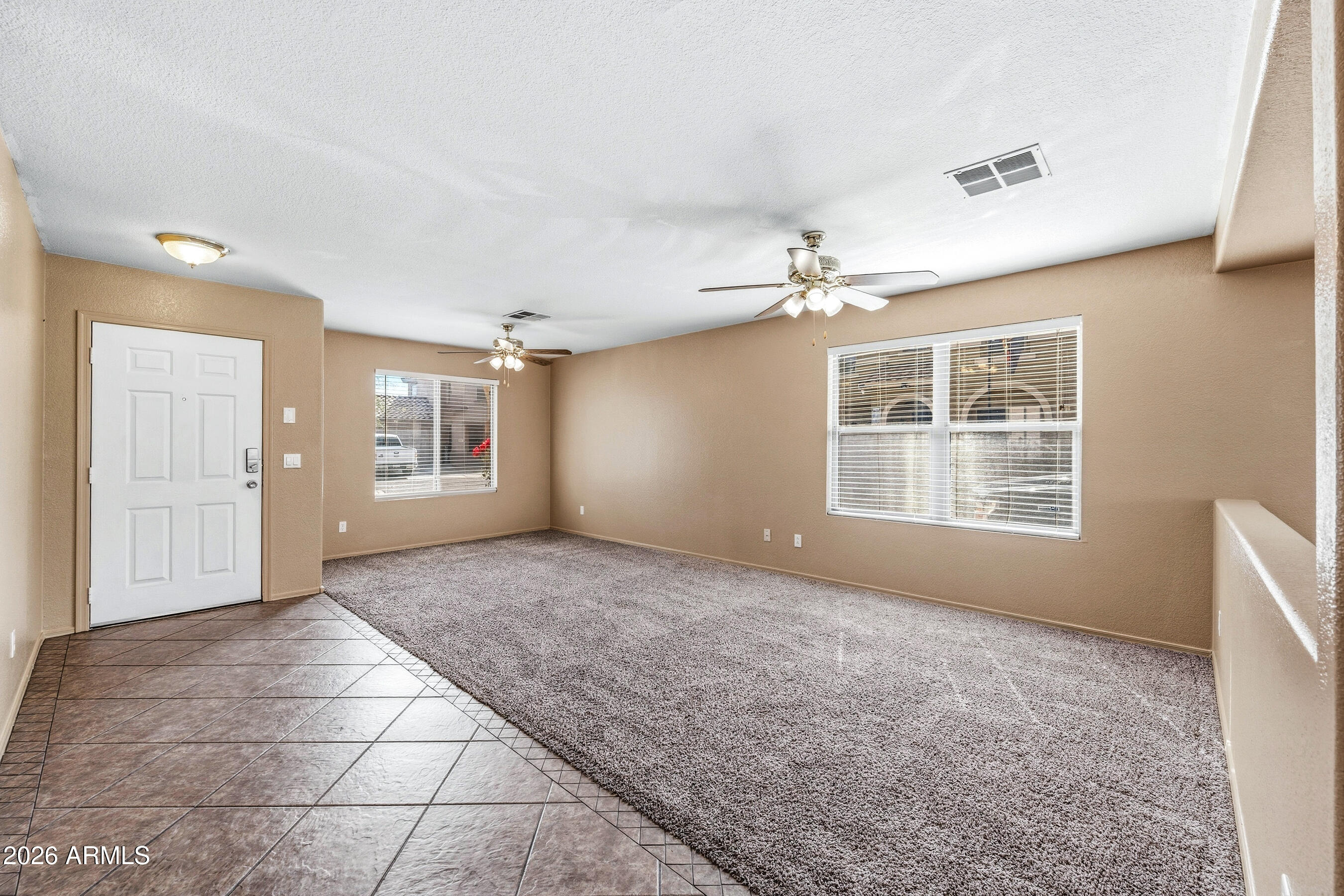 9515 West Monte Vista Road Phoenix, AZ 85037 - Photo 3 of 29 a view of an empty room with a window