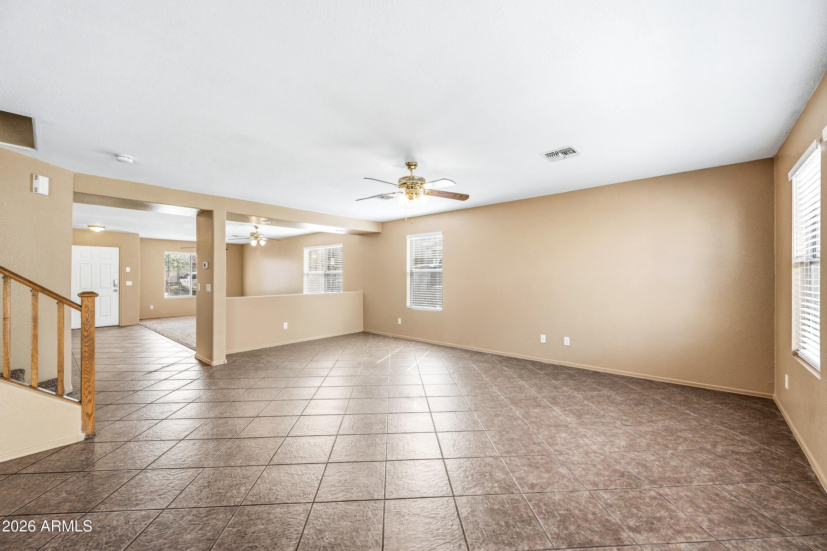 9515 West Monte Vista Road Phoenix, AZ 85037 - Photo 6 of 29 a view of an empty room with a window