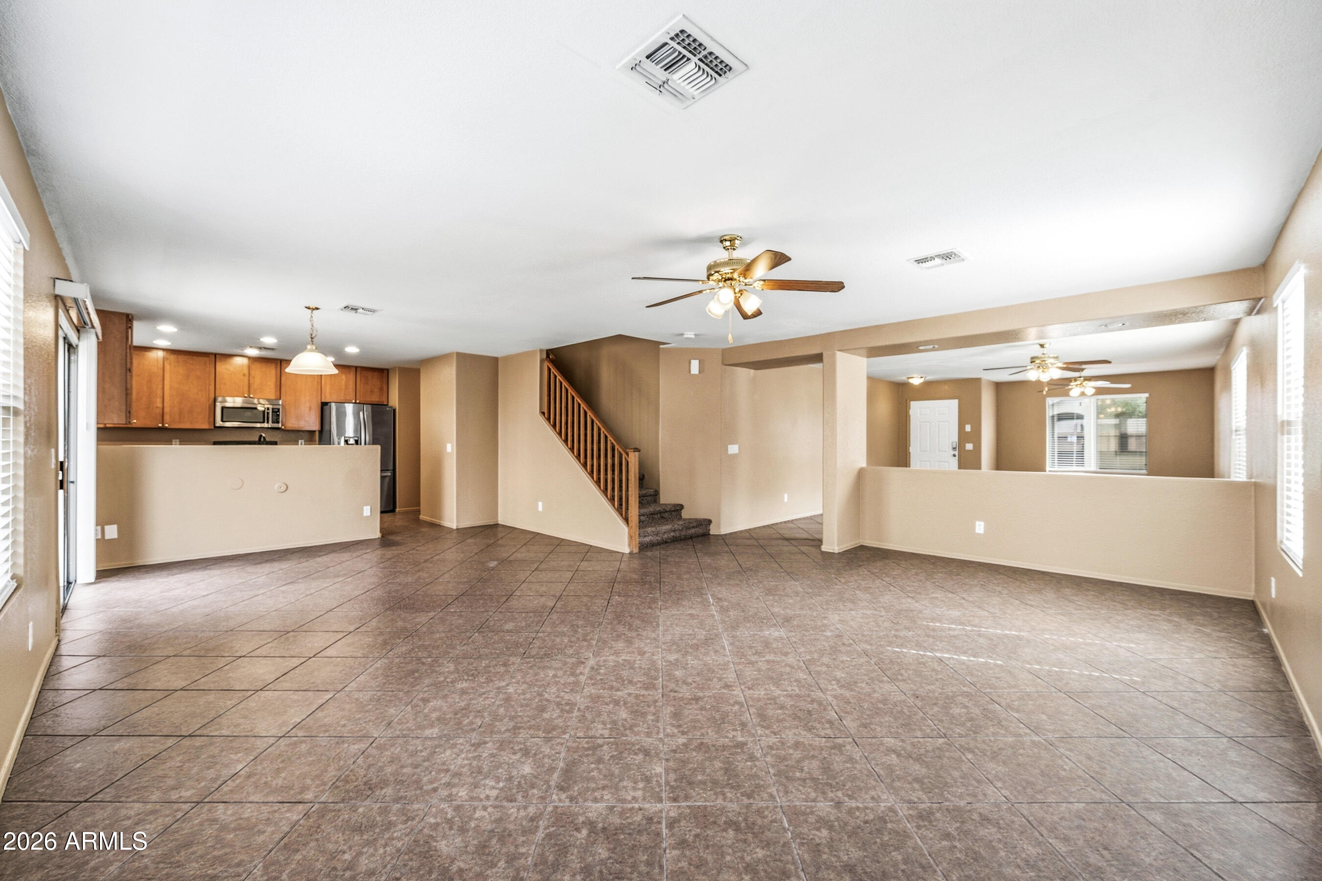 9515 West Monte Vista Road Phoenix, AZ 85037 - Photo 7 of 29 a view of an empty room with a window