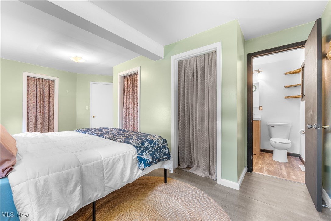 1515 Deville Avenue Northwest Canton, OH 44708 - Photo 17 of 42 Bedroom featuring wood finished floors and baseboards