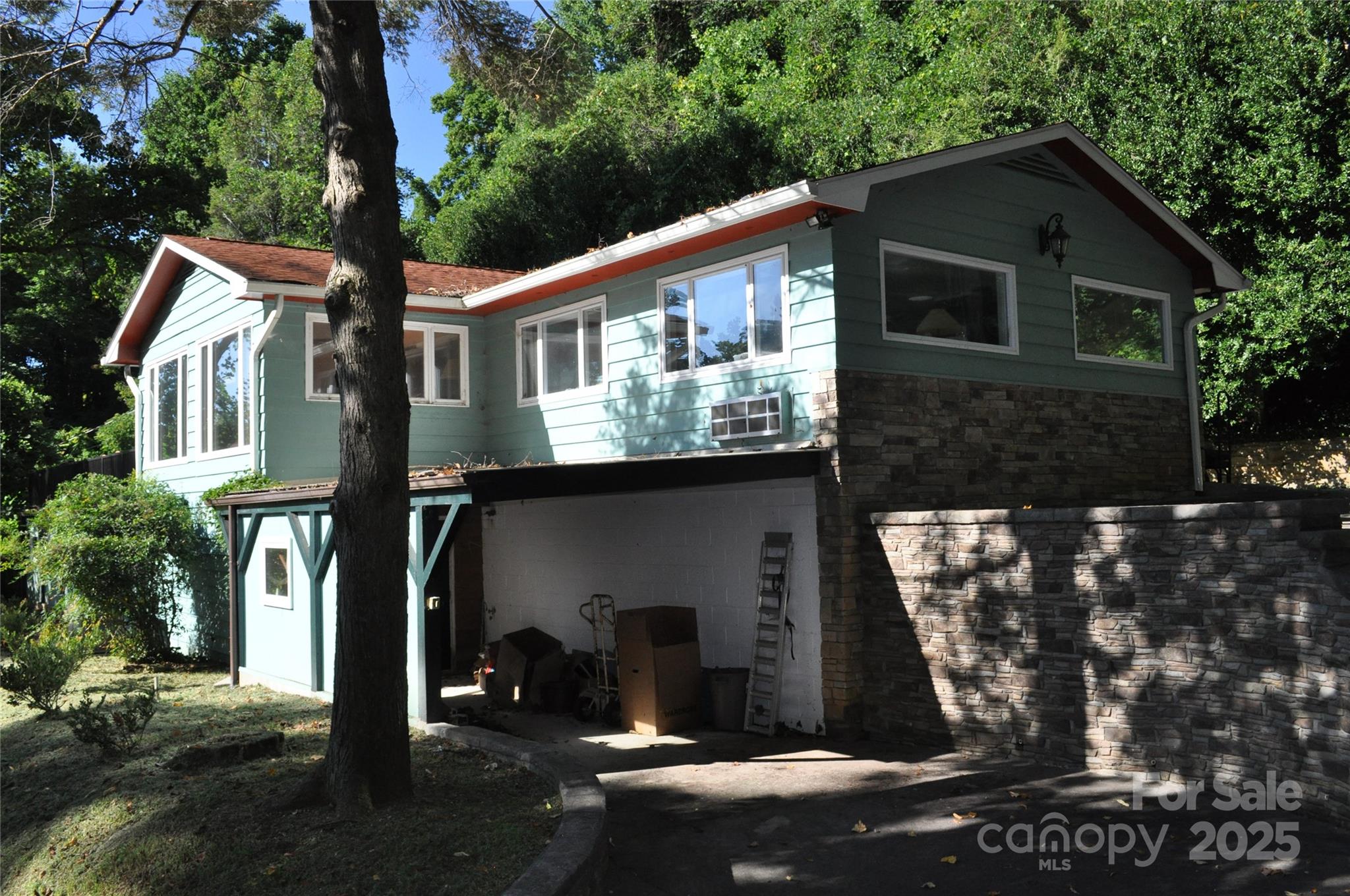 502 Meadowlark Drive Tryon, NC 28782 - Photo 1 of 40 a front view of a house with garden