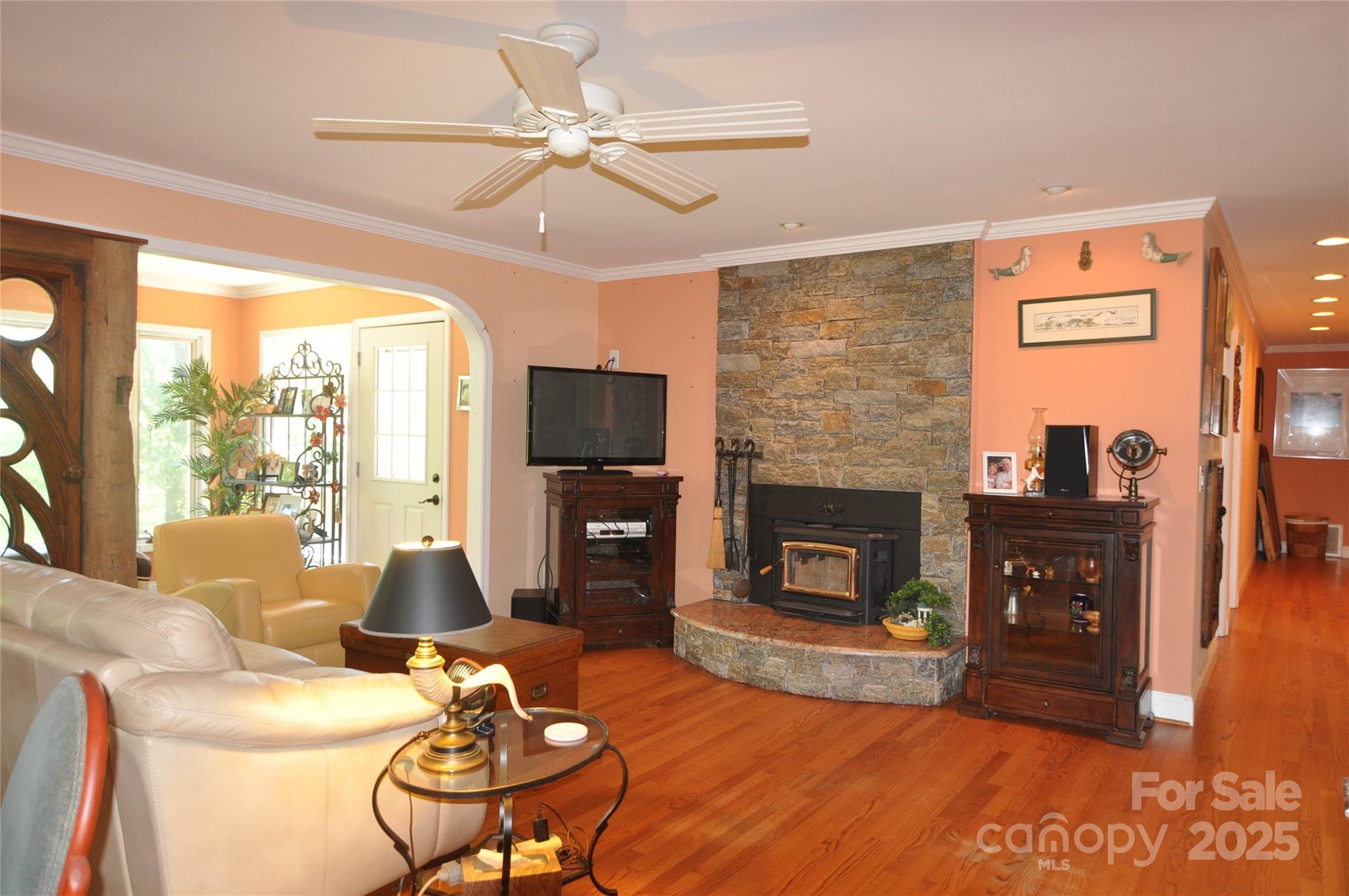 502 Meadowlark Drive Tryon, NC 28782 - Photo 12 of 40 a living room with furniture a fireplace and a flat screen tv