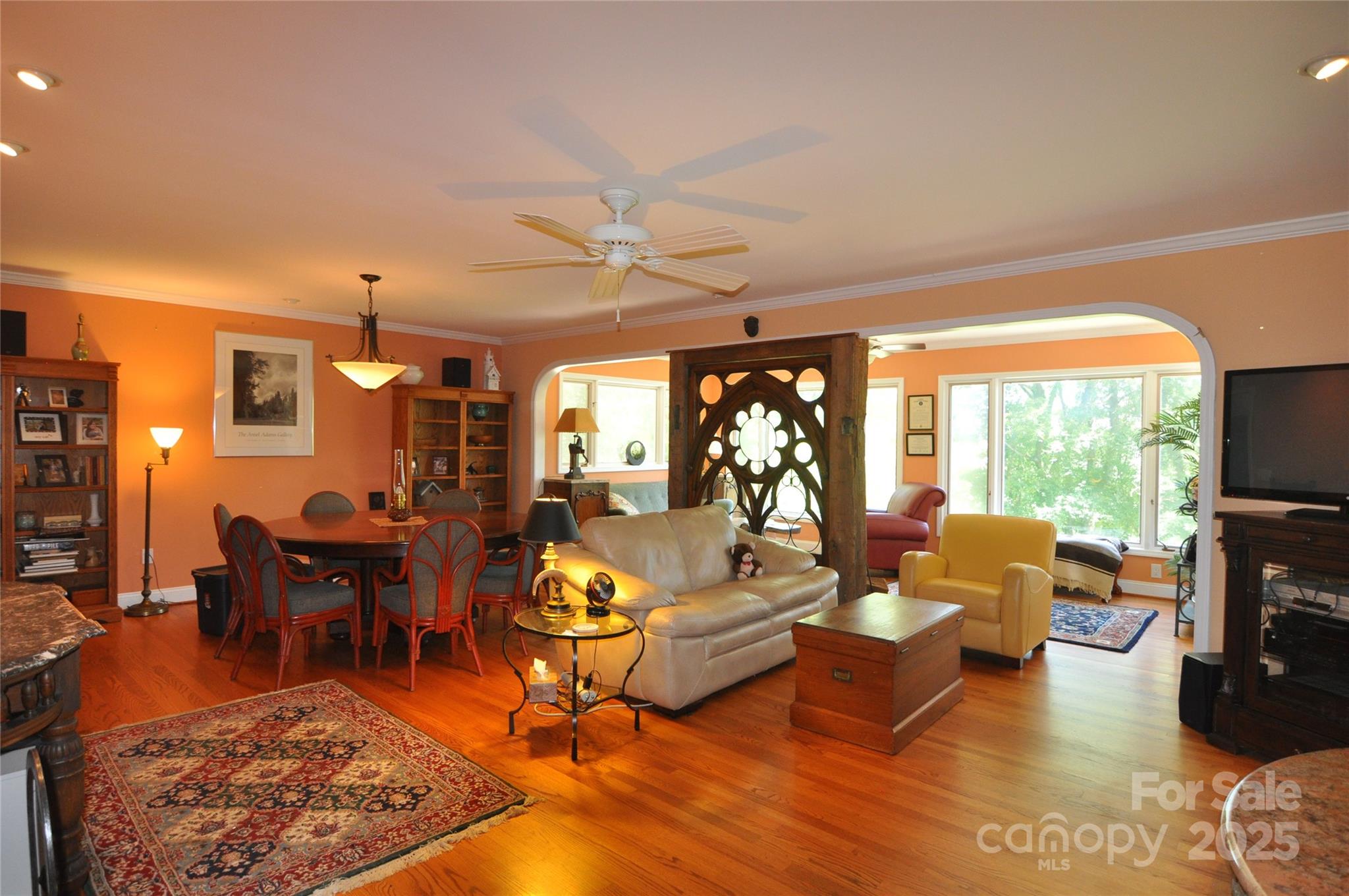 502 Meadowlark Drive Tryon, NC 28782 - Photo 13 of 40 a living room with furniture a flat screen tv and a large window