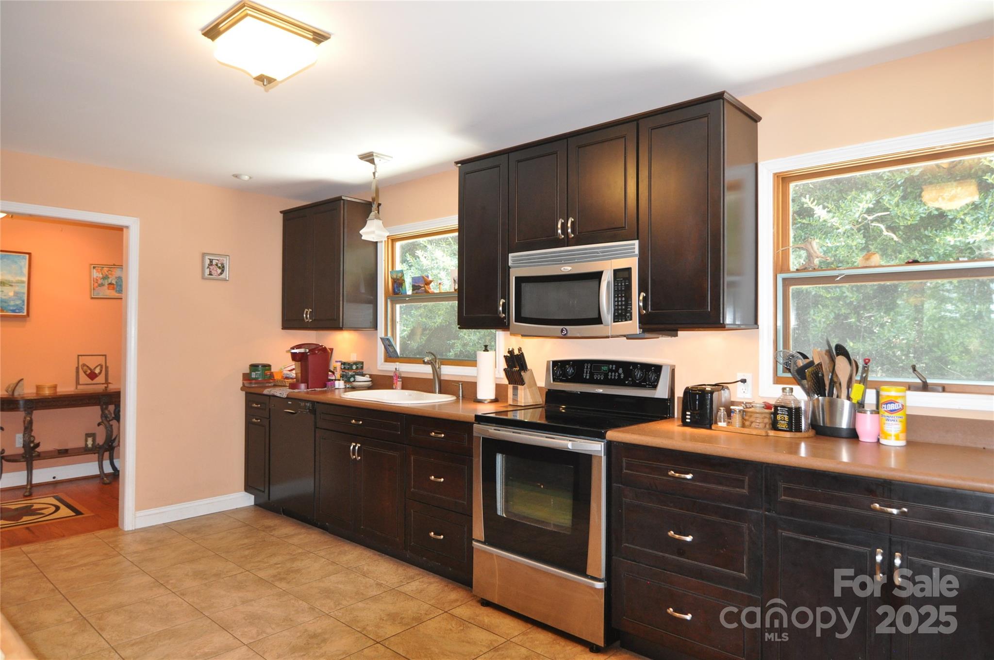 502 Meadowlark Drive Tryon, NC 28782 - Photo 23 of 40 a kitchen with granite countertop a stove and cabinets