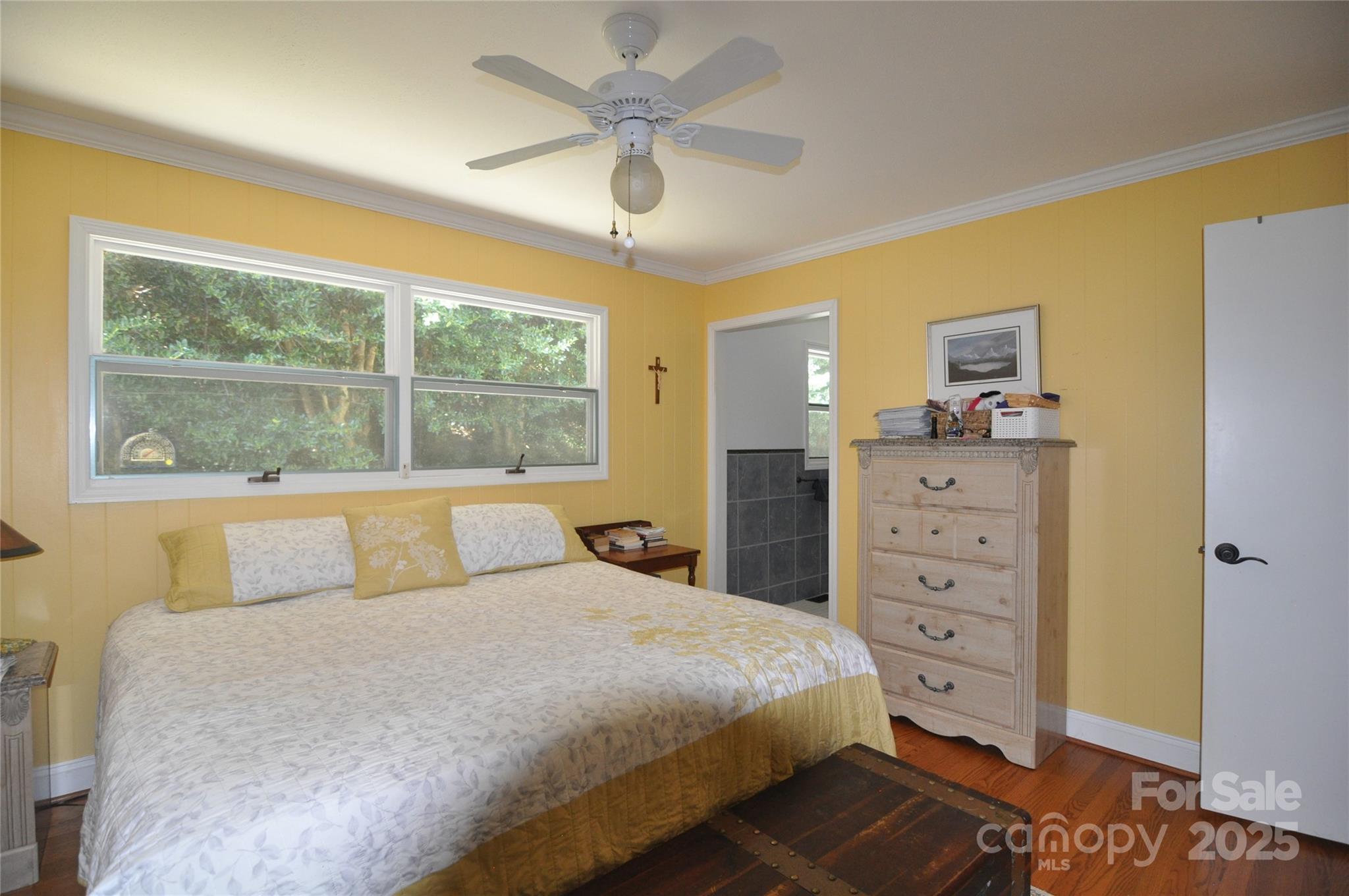 502 Meadowlark Drive Tryon, NC 28782 - Photo 24 of 40 a bedroom with a bed and a dresser
