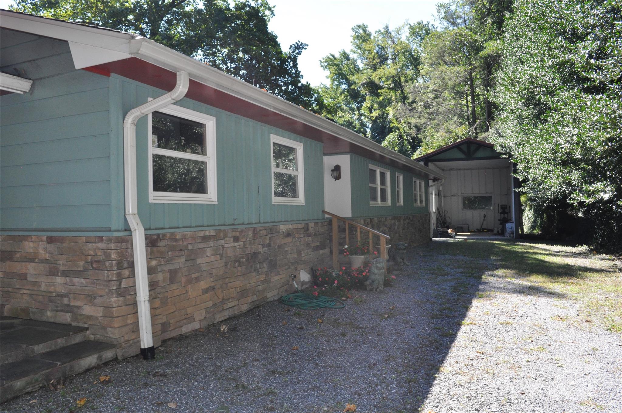 502 Meadowlark Drive Tryon, NC 28782 - Photo 8 of 40 a front view of a house with garden