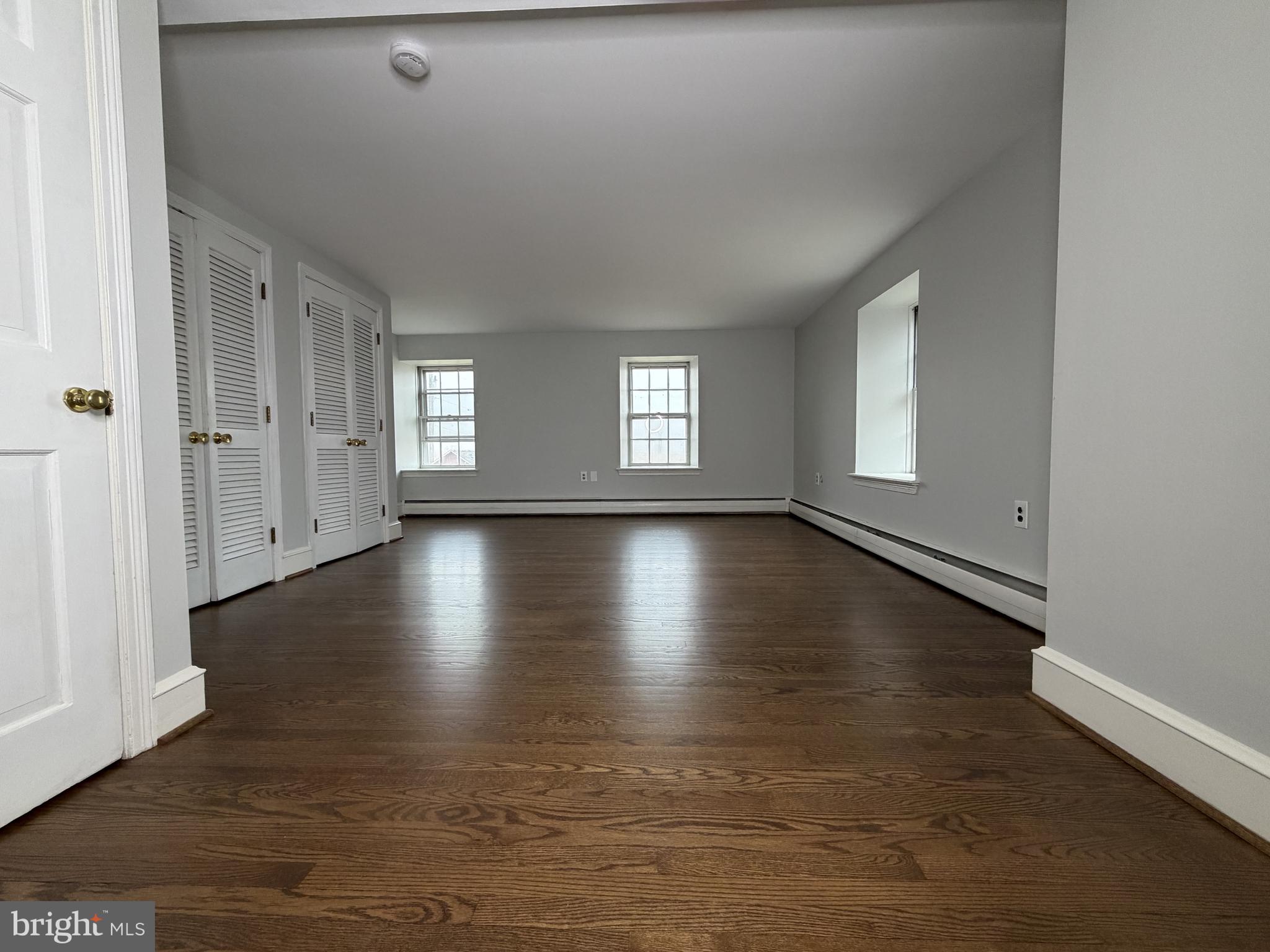 4700 Thompsons Bridge Road Wilmington, DE 19803 - Photo 27 of 41 wooden floor in an empty room with a window