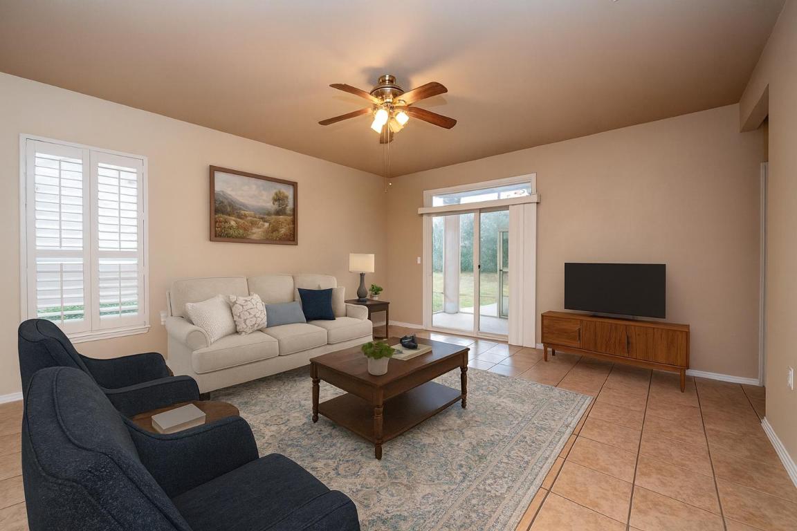 510 Crockett Loop Georgetown, TX 78633 - Photo 6 of 16 a living room with furniture and a flat screen tv