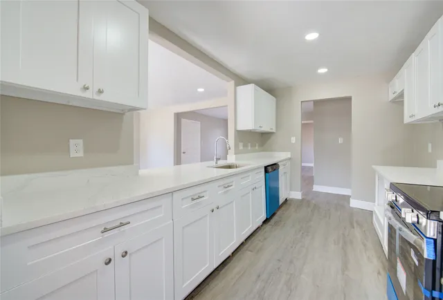 a large kitchen with cabinets