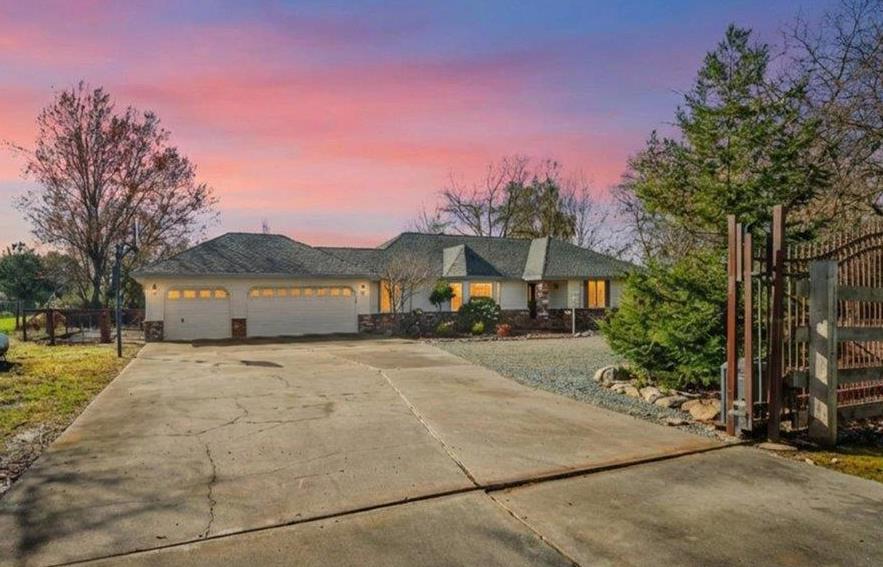 9777 Tavernor Road Wilton, CA 95693 - Photo 1 of 59 a front view of a house with a yard and garage