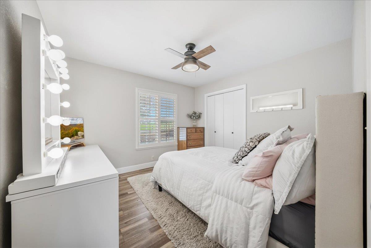 9777 Tavernor Road Wilton, CA 95693 - Photo 17 of 59 a bedroom with a bed and a chandelier