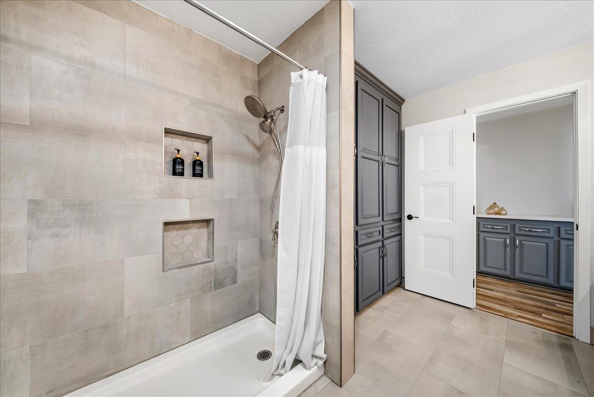 9777 Tavernor Road Wilton, CA 95693 - Photo 19 of 59 a bathroom with a tub and shower