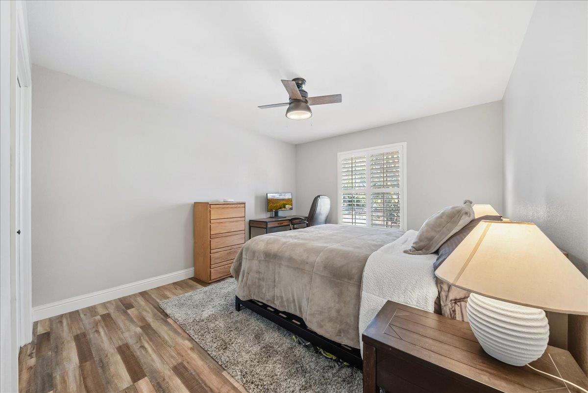 9777 Tavernor Road Wilton, CA 95693 - Photo 20 of 59 a bedroom with a bed and wooden floor