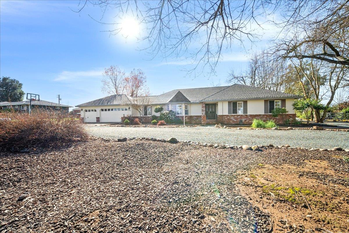 9777 Tavernor Road Wilton, CA 95693 - Photo 2 of 59 a front view of a house with a yard