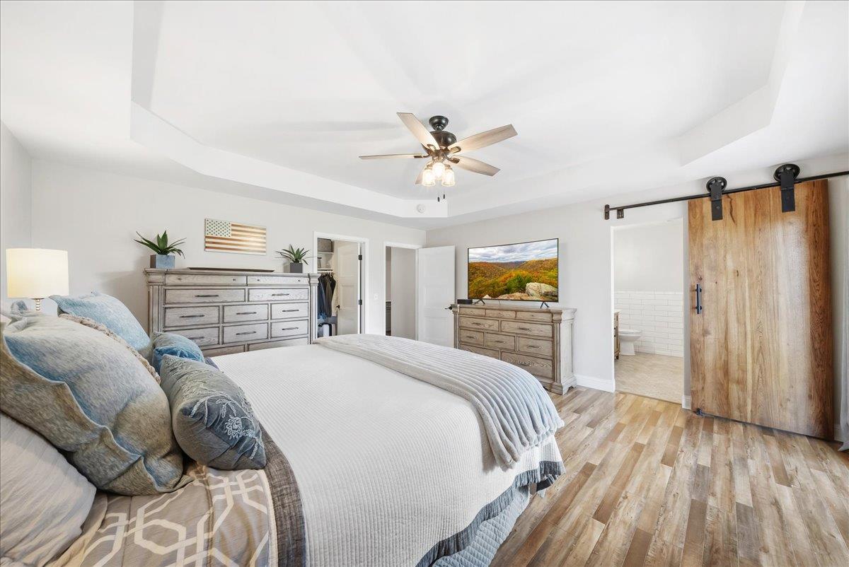 9777 Tavernor Road Wilton, CA 95693 - Photo 22 of 59 a bedroom with a bed and a walk in closet