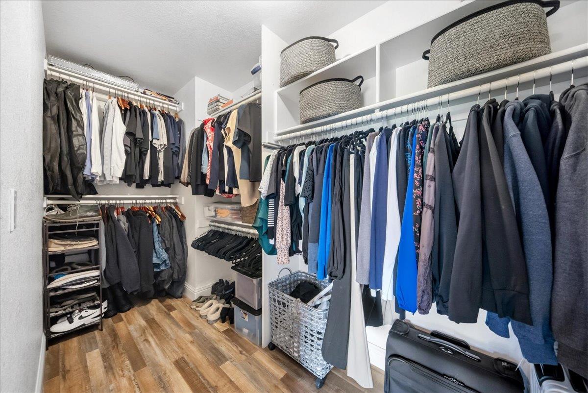 9777 Tavernor Road Wilton, CA 95693 - Photo 23 of 59 a view of walk in closet with clothes and shoes