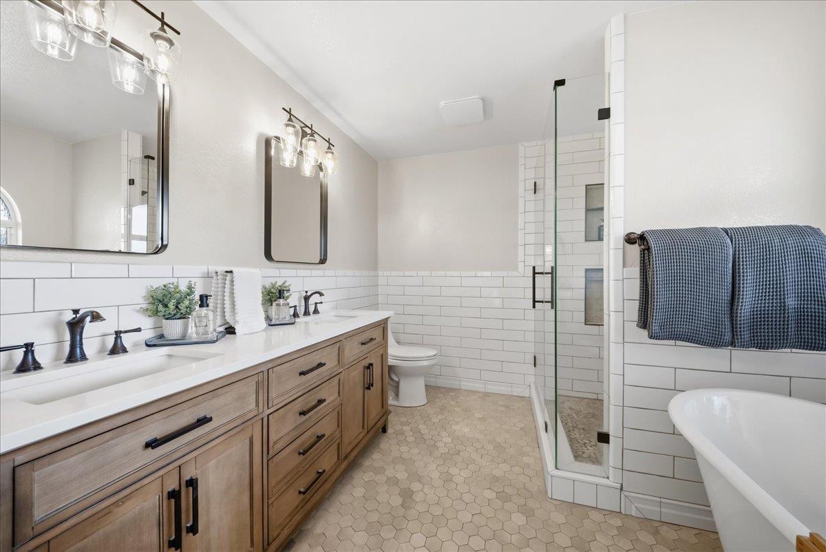 9777 Tavernor Road Wilton, CA 95693 - Photo 24 of 59 a spacious bathroom with a double vanity sink mirror and toilet