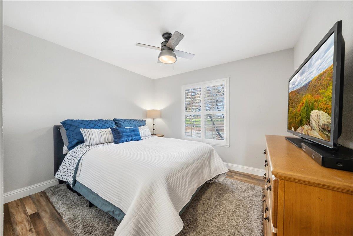 9777 Tavernor Road Wilton, CA 95693 - Photo 28 of 59 a bedroom with a bed and a flat tv screen on dresser