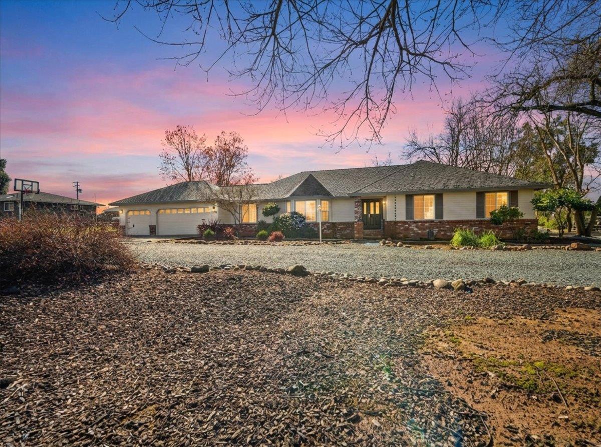 9777 Tavernor Road Wilton, CA 95693 - Photo 3 of 59 a front view of a house with a yard