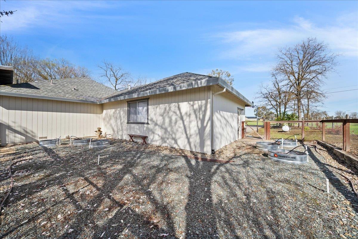 9777 Tavernor Road Wilton, CA 95693 - Photo 35 of 59 a view of a house with a yard