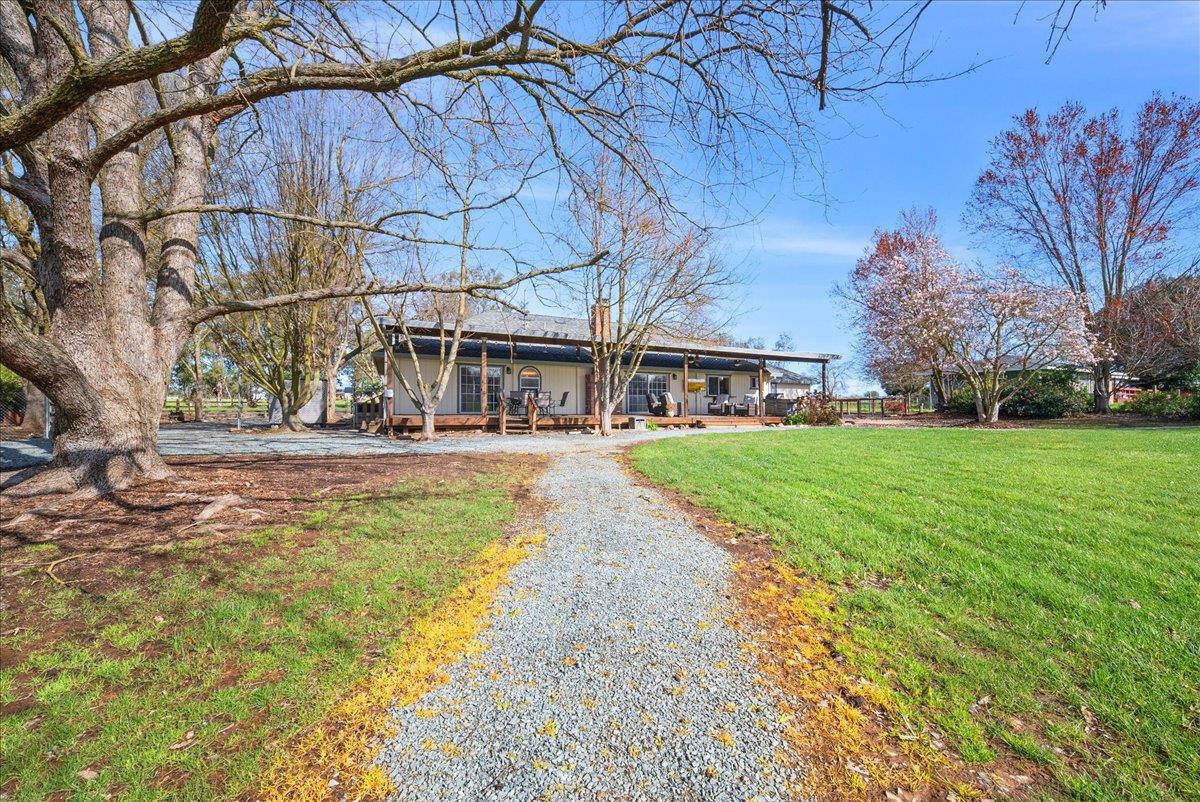 9777 Tavernor Road Wilton, CA 95693 - Photo 39 of 59 a view of a house with a yard